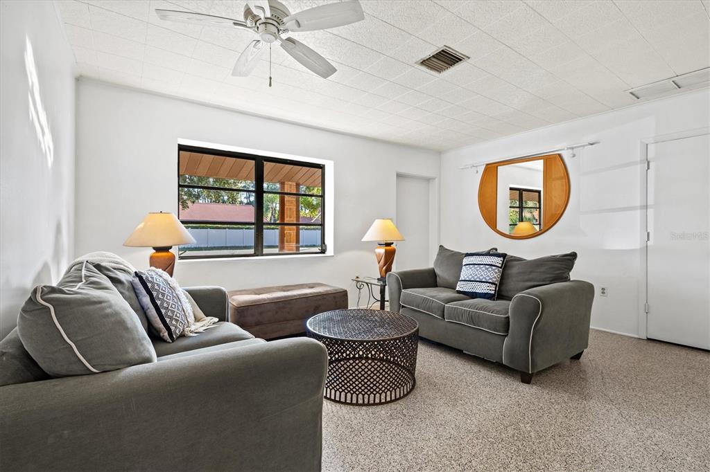 148 Roberts Road Nokomis, FL 34275 - Photo 2 of 68 a living room with furniture and a large window