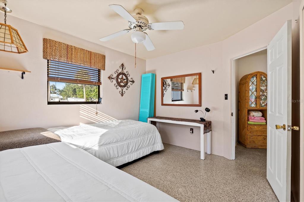 148 Roberts Road Nokomis, FL 34275 - Photo 28 of 68 a bedroom with a bed dresser and window