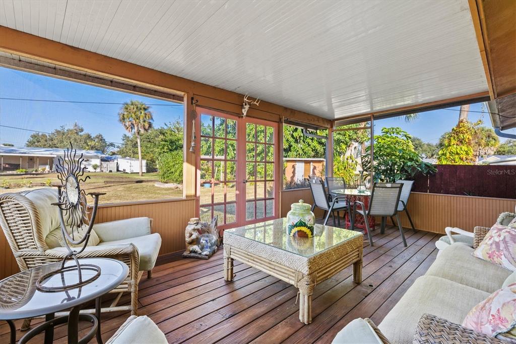 148 Roberts Road Nokomis, FL 34275 - Photo 33 of 68 a outdoor living space with furniture and garden view