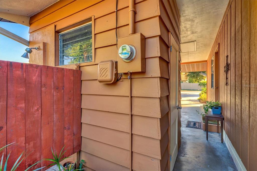 148 Roberts Road Nokomis, FL 34275 - Photo 41 of 68 a view of a street with wooden fence and porch