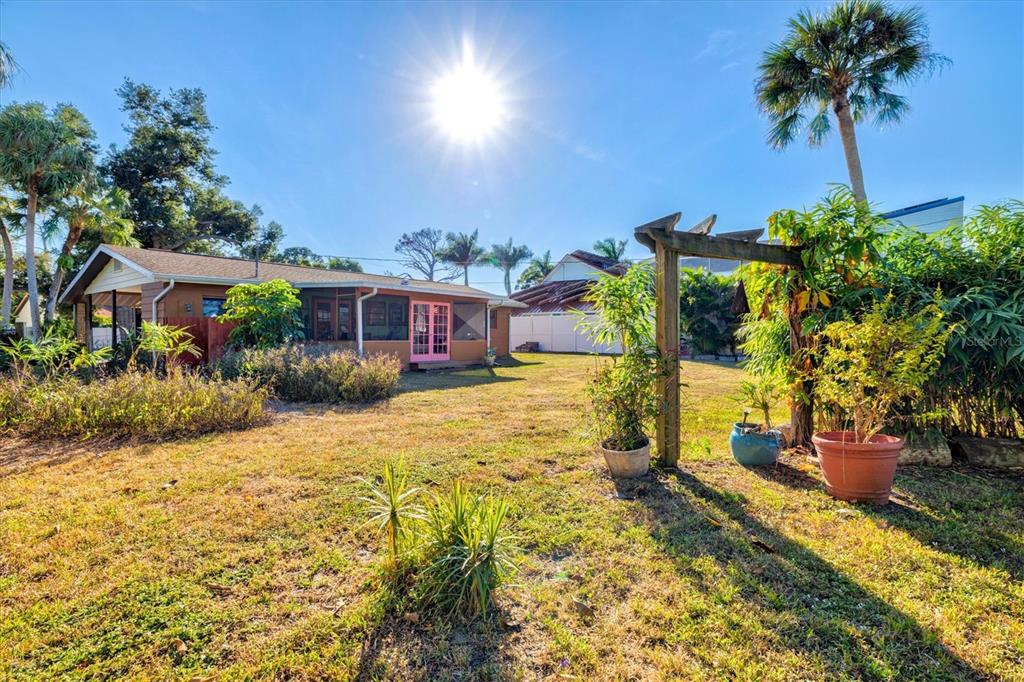 148 Roberts Road Nokomis, FL 34275 - Photo 43 of 68 a front view of a house with yard and seating area