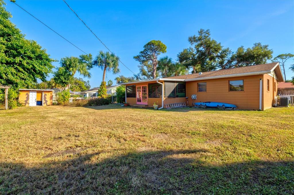 148 Roberts Road Nokomis, FL 34275 - Photo 46 of 68 a front view of a house with garden