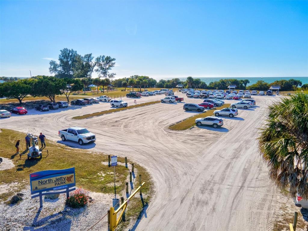 148 Roberts Road Nokomis, FL 34275 - Photo 62 of 68 a view of a swimming pool and lounge chairs