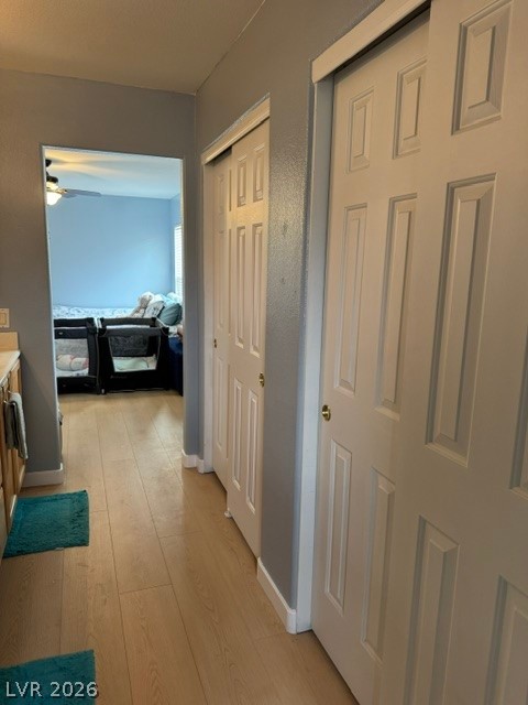 5171 Piazza Cavour Drive Las Vegas, NV 89156 - Photo 7 of 13 Streamlined hall space with convenient closet storage, connecting to another room.