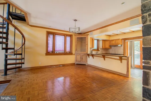 a view of a kitchen with a sink and a refrigerator