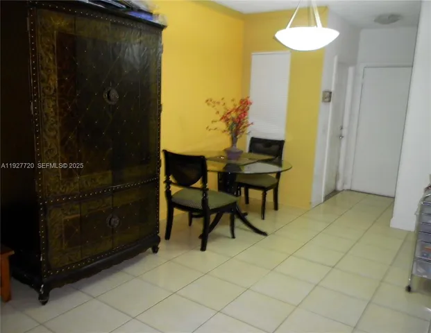 a view of a livingroom with furniture and chandelier fan