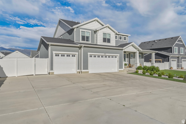 870 North Ada Loop Lehi, UT 84048 - Photo 4 of 51 Contemporary two-story residence featuring a gray and white siding exterior