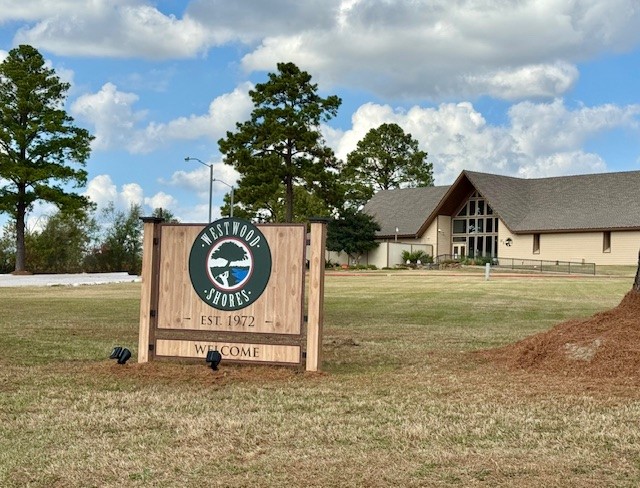 9 Morningside Street Trinity, TX 75862 - Photo 8 of 8 a sign board with yard in the back