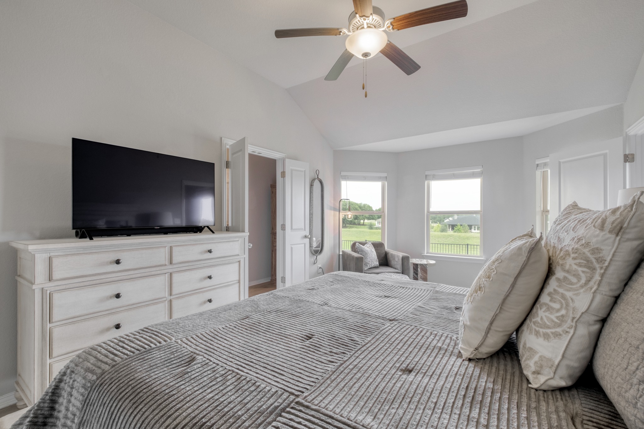 1000 Bright Star Cove Georgetown, TX 78628 - Photo 18 of 40 a bedroom with a bed flat screen tv and a window
