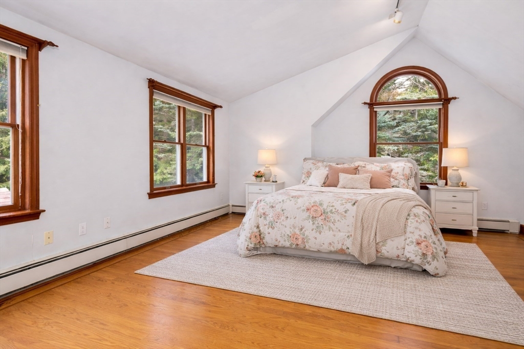29 Boulevard Road Dedham, MA 02026 - Photo 17 of 34 a bedroom with a bed and a window