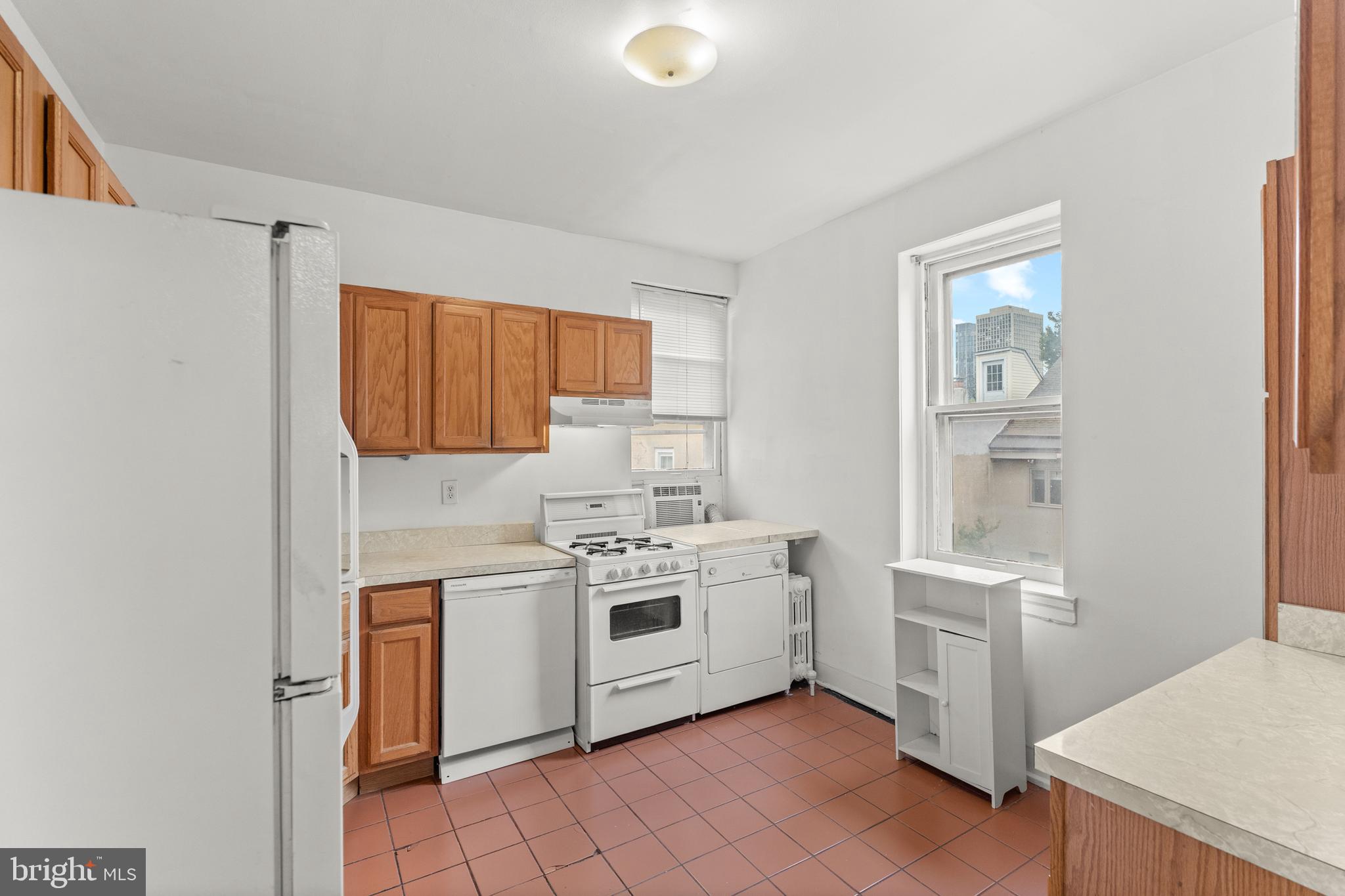 409 Pine Street, Unit 3 Philadelphia, PA 19106 - Photo 16 of 30 a kitchen with a stove sink and cabinets