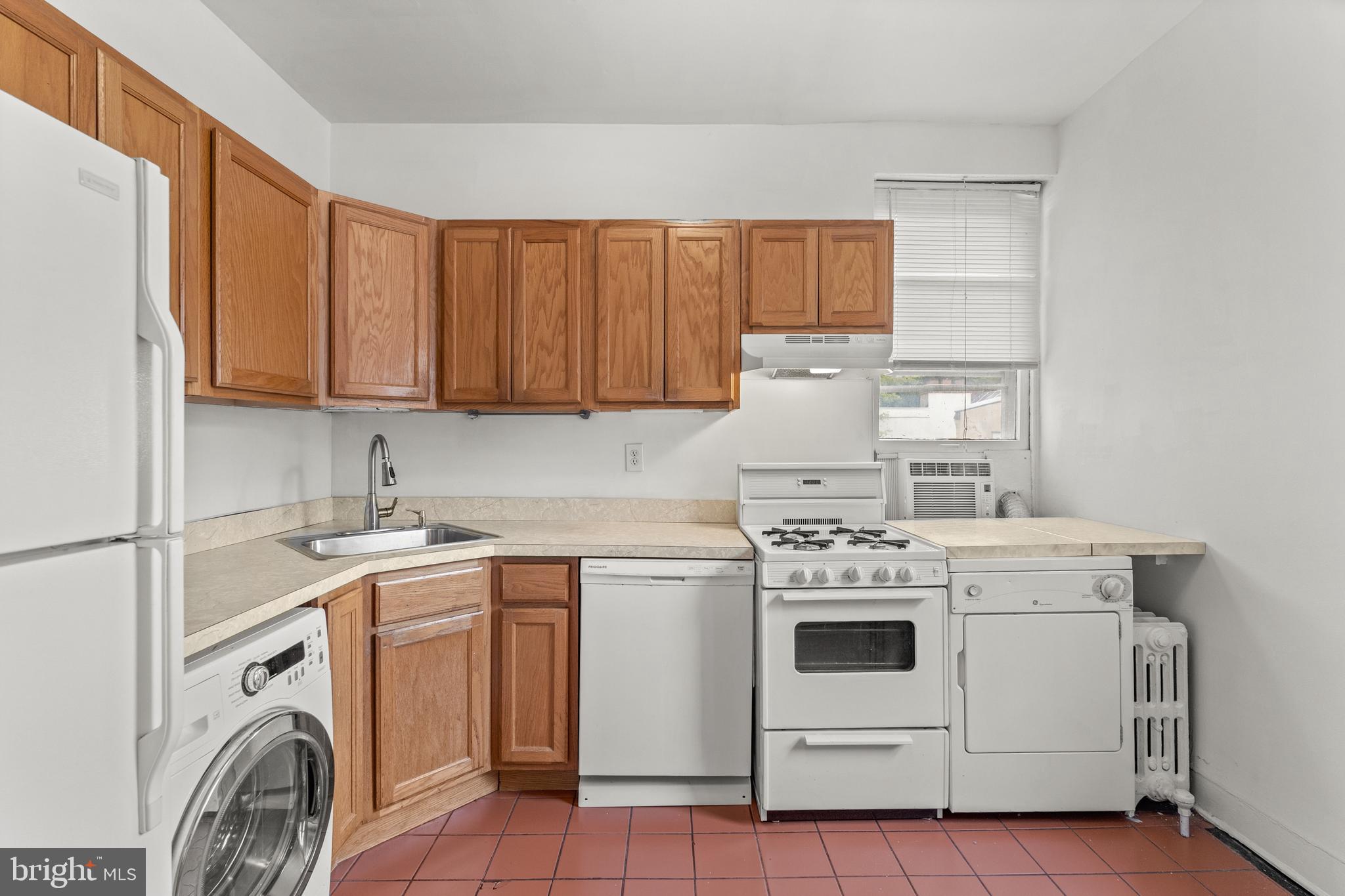 409 Pine Street, Unit 3 Philadelphia, PA 19106 - Photo 18 of 30 a kitchen with a stove top oven sink and cabinets