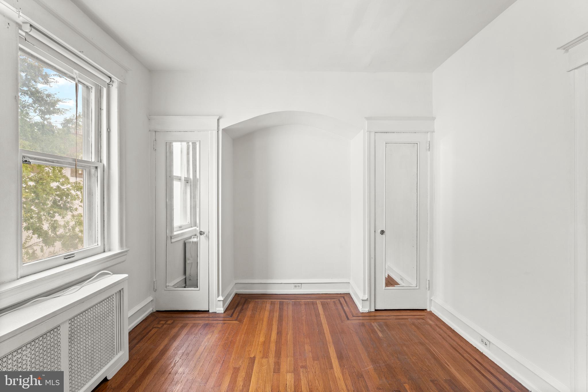 409 Pine Street, Unit 3 Philadelphia, PA 19106 - Photo 28 of 30 wooden floor in an empty room with a window