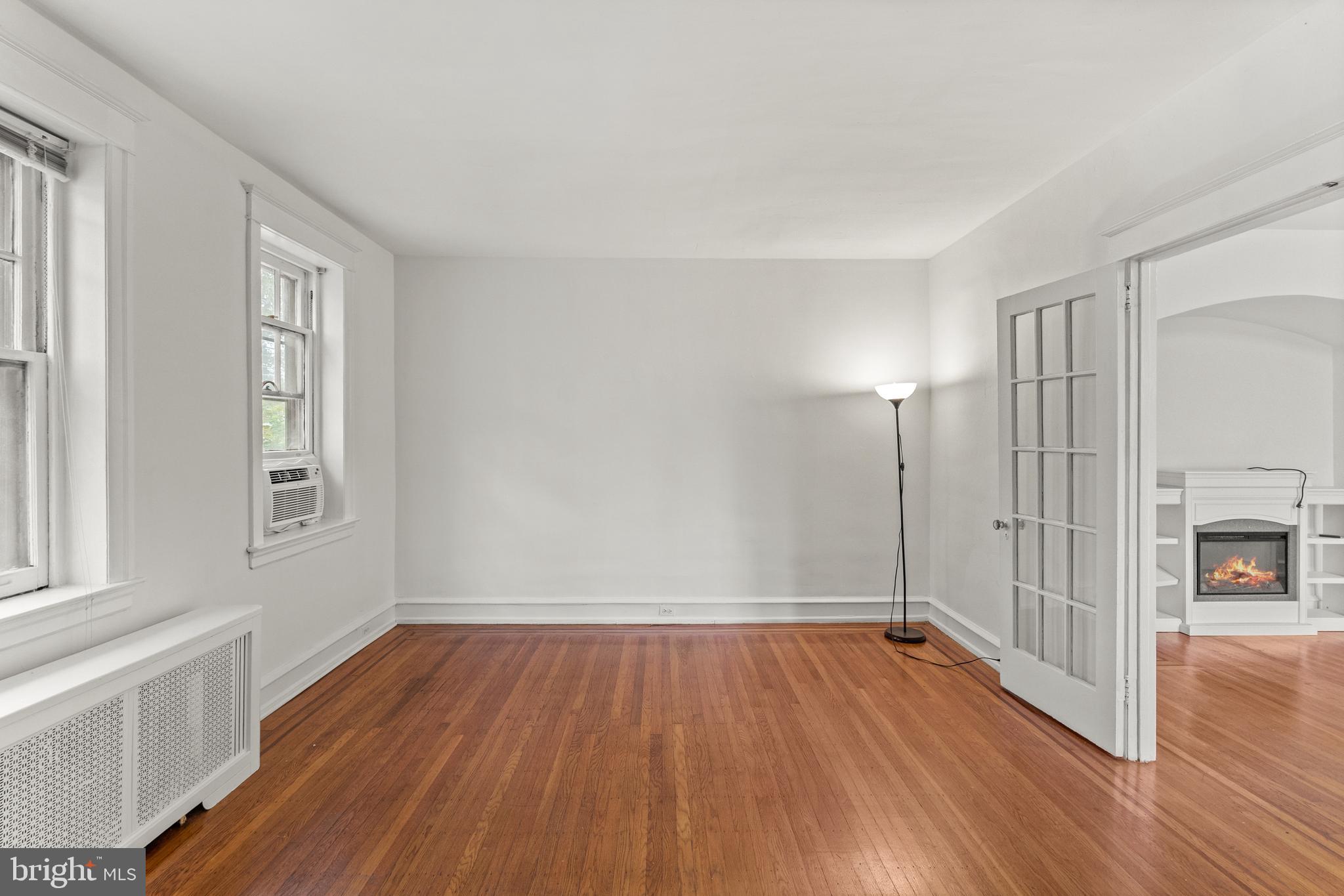 409 Pine Street, Unit 3 Philadelphia, PA 19106 - Photo 8 of 30 wooden floor in an empty room with a window