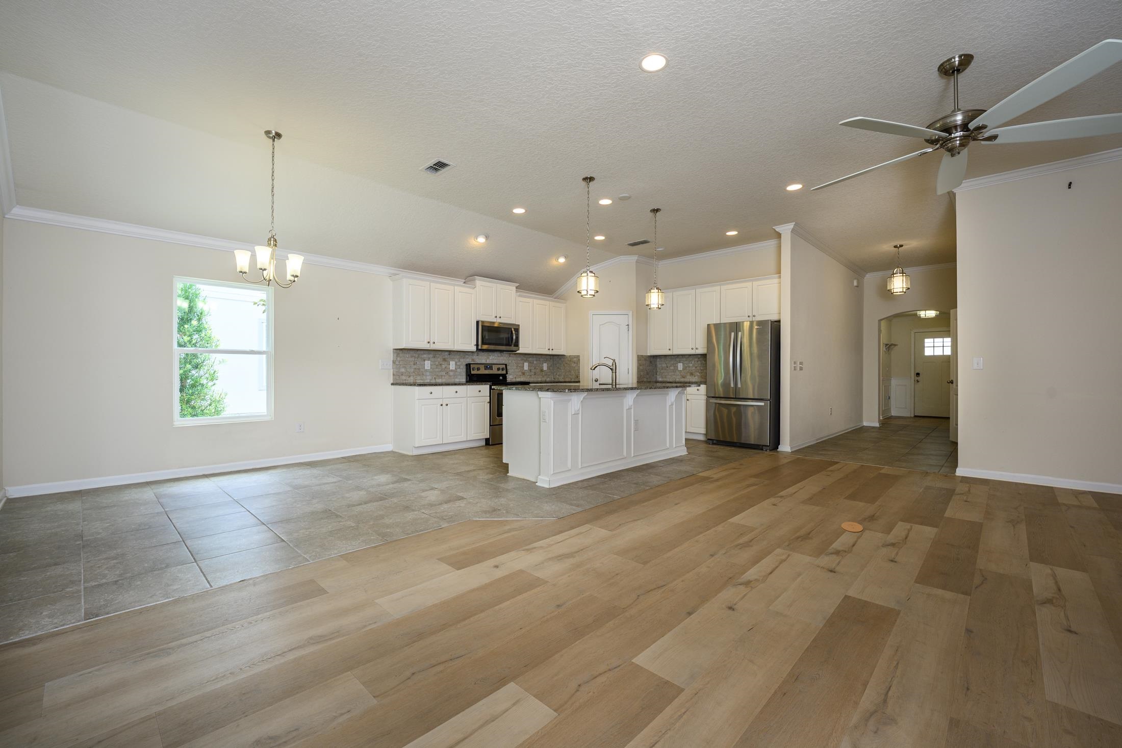 772 Pullman Circle St. Augustine, FL 32084 - Photo 16 of 77 a view of kitchen with a refrigerator a ceiling fan and a window