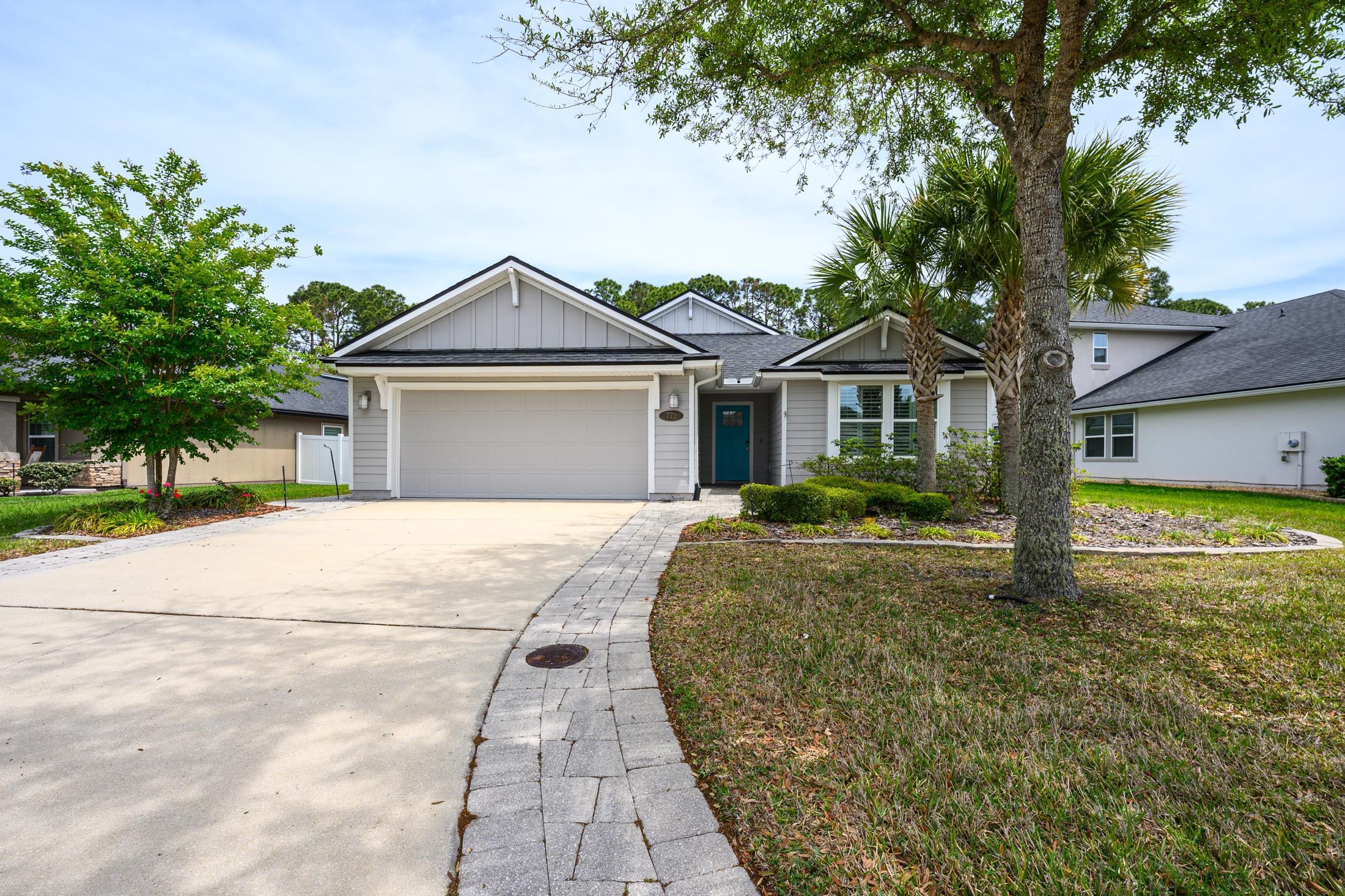 772 Pullman Circle St. Augustine, FL 32084 - Photo 2 of 77 a front view of a house with a yard and garage