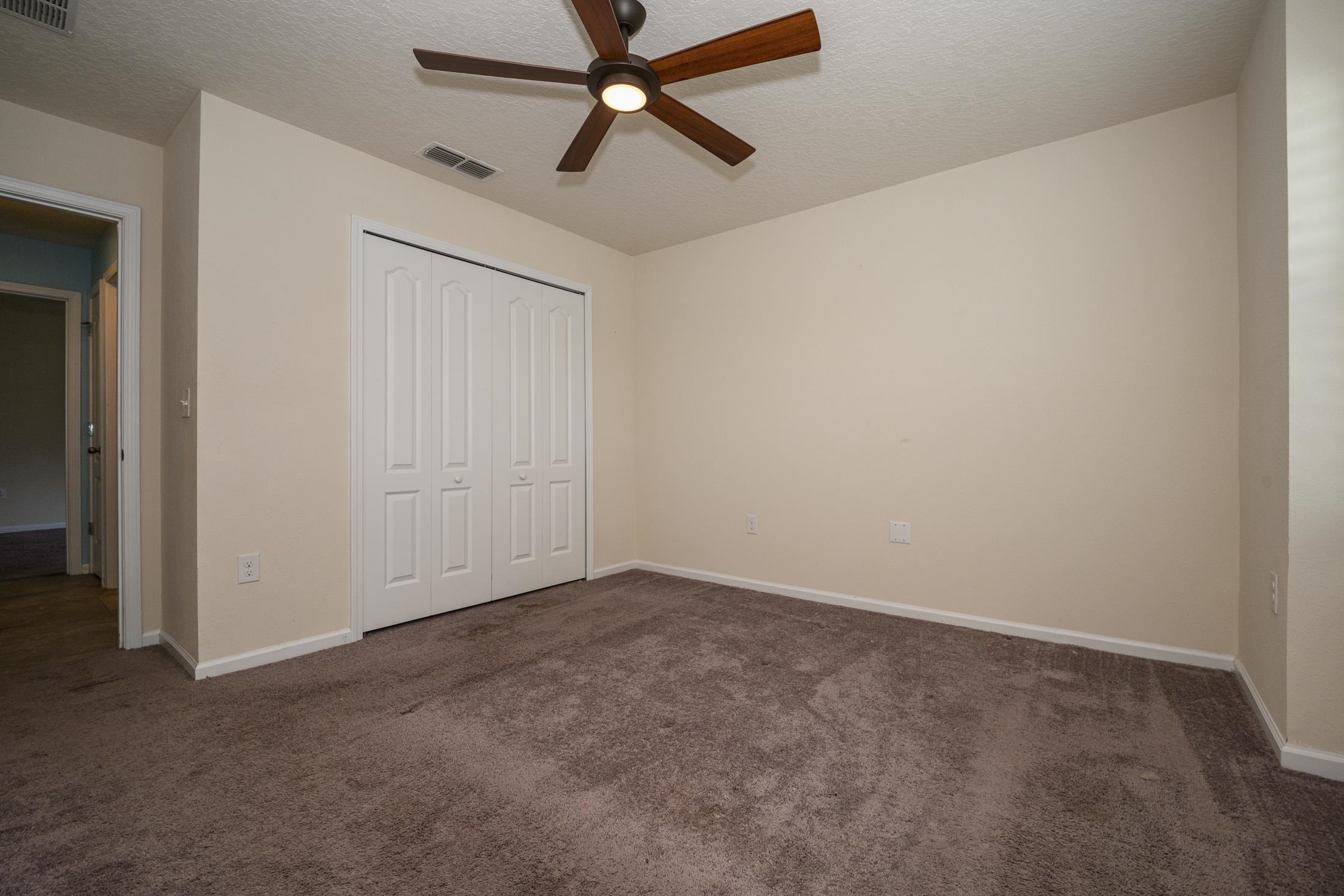 772 Pullman Circle St. Augustine, FL 32084 - Photo 27 of 77 an empty room with closet and a ceiling fan