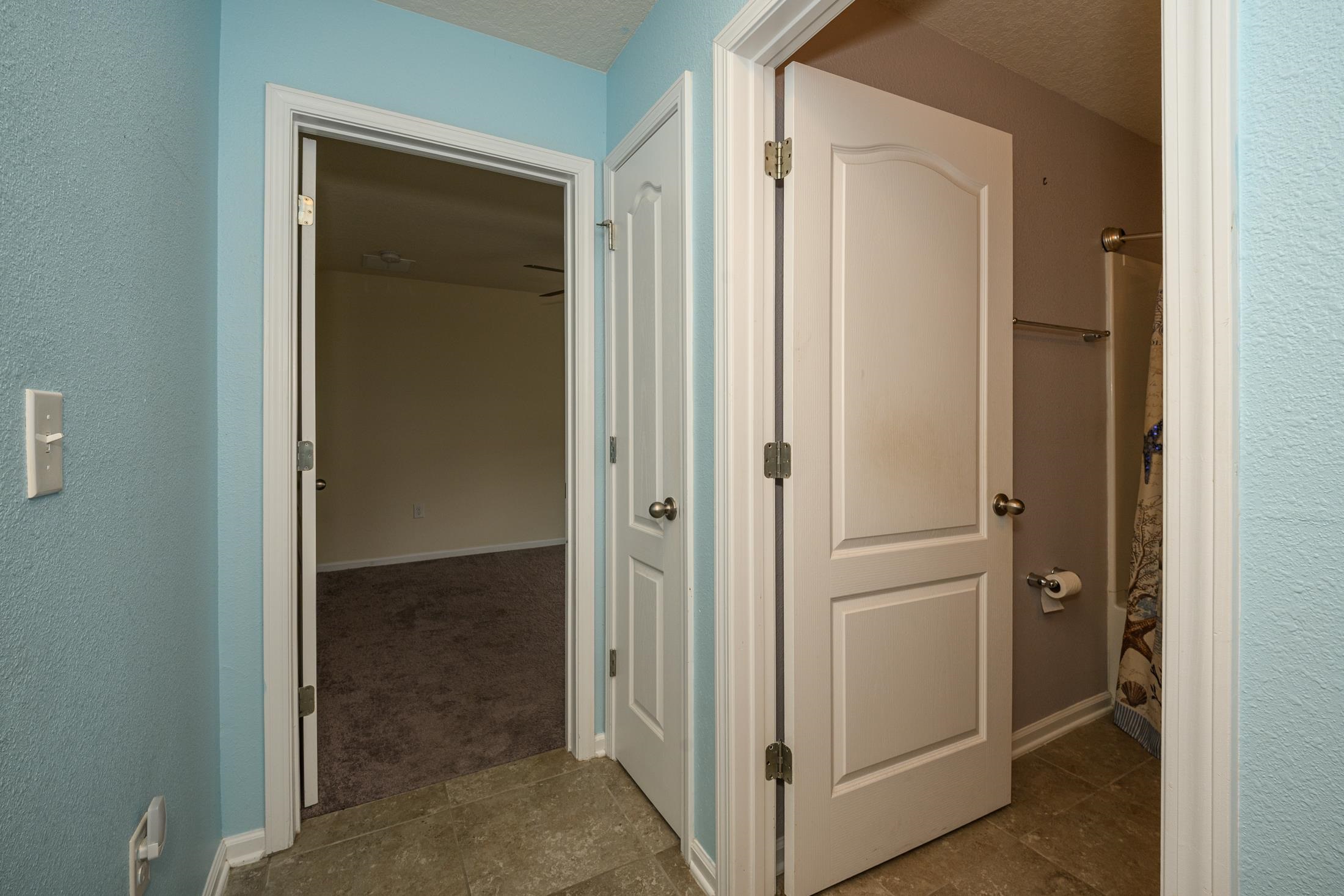 772 Pullman Circle St. Augustine, FL 32084 - Photo 28 of 77 a view of a bathroom with a glass door