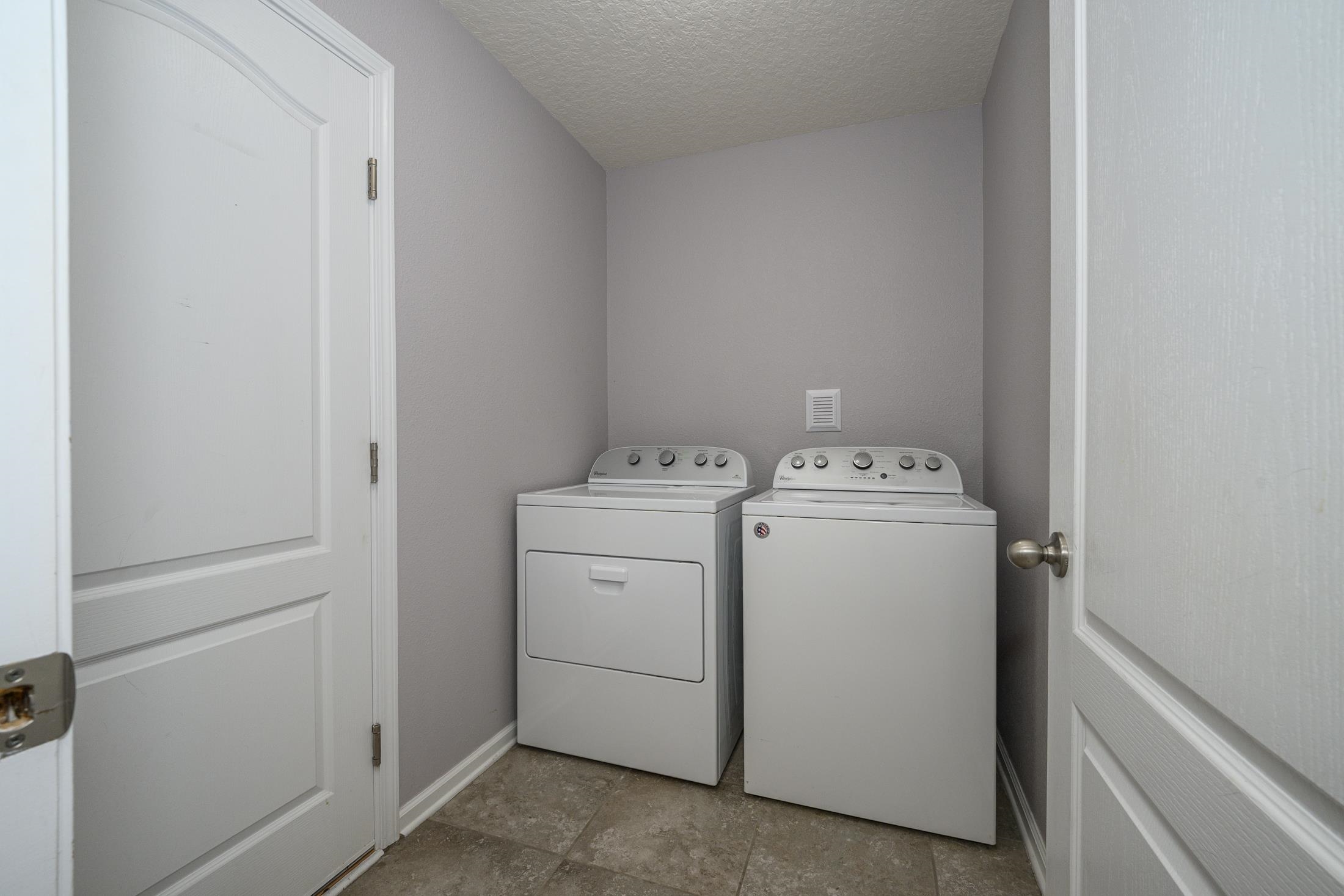 772 Pullman Circle St. Augustine, FL 32084 - Photo 36 of 77 a utility room with dryer and washer
