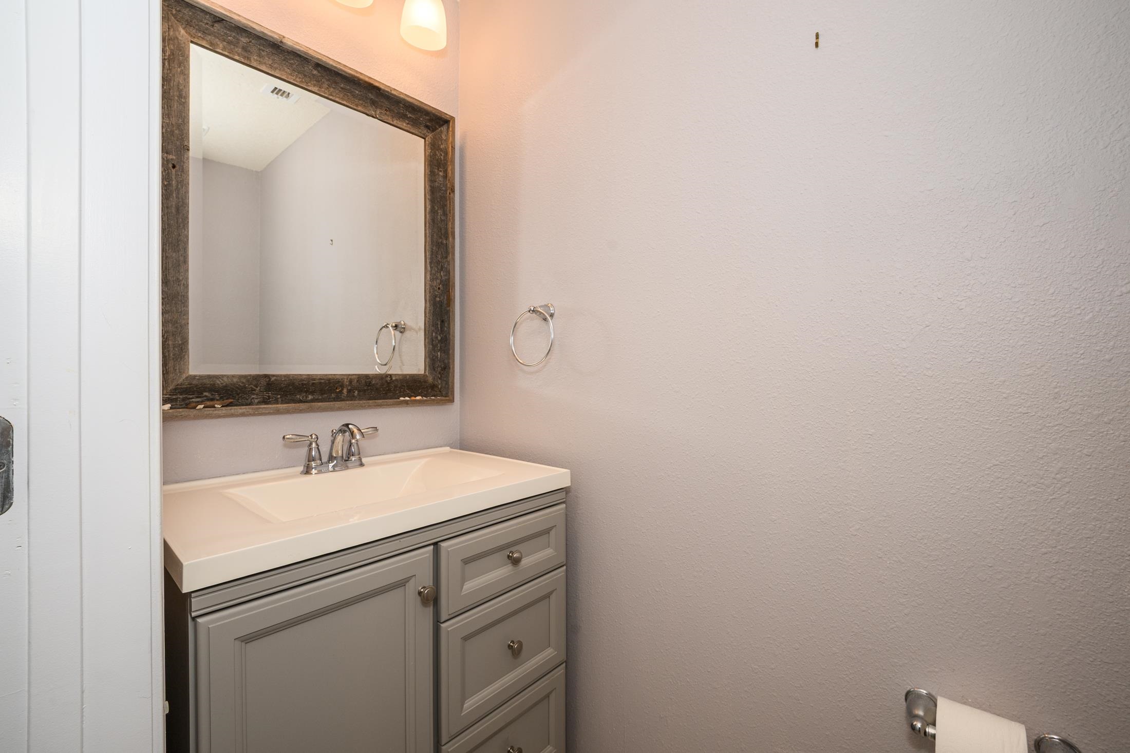 772 Pullman Circle St. Augustine, FL 32084 - Photo 40 of 77 a bathroom with a sink and a mirror