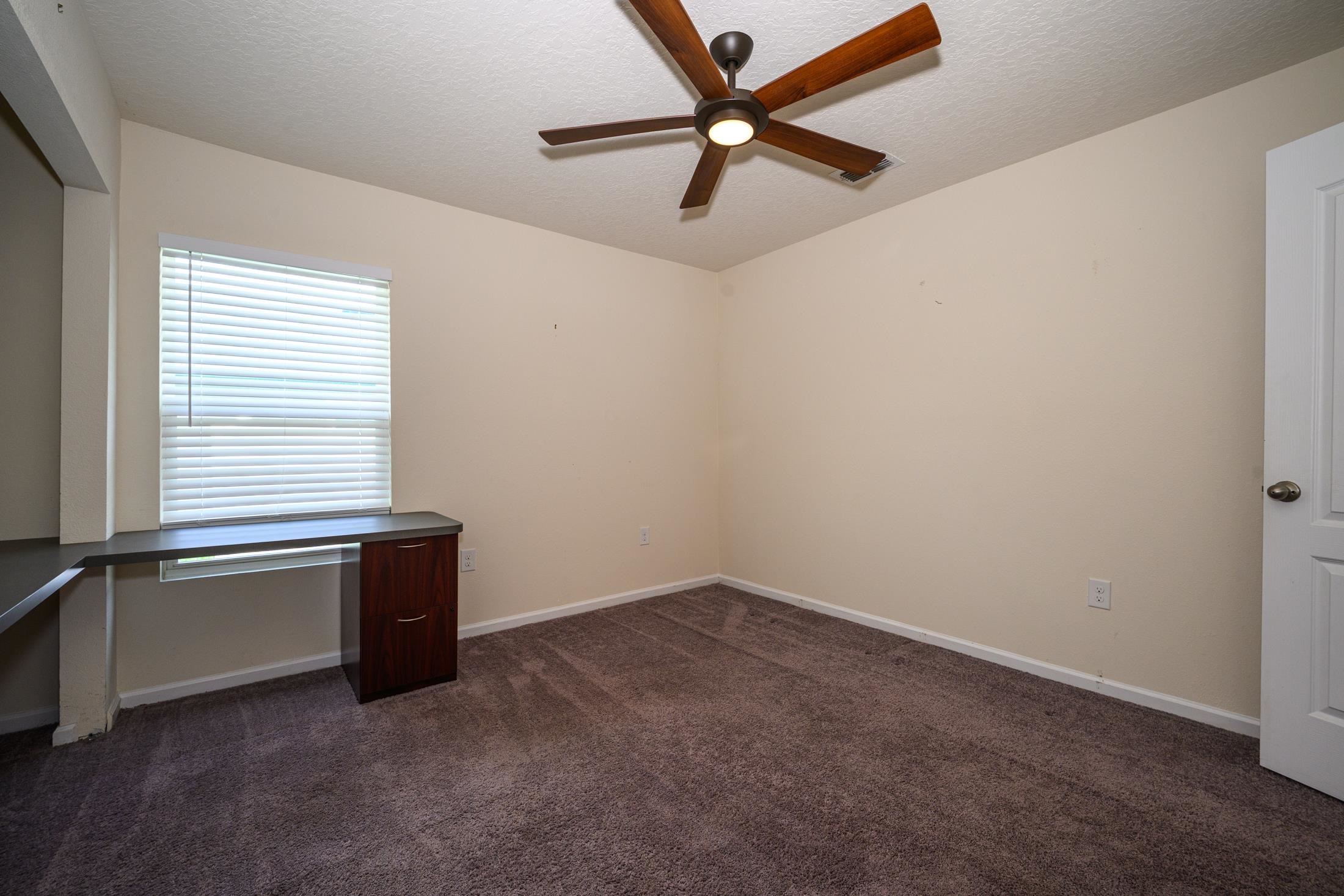 772 Pullman Circle St. Augustine, FL 32084 - Photo 45 of 77 an empty room with a window and a fan