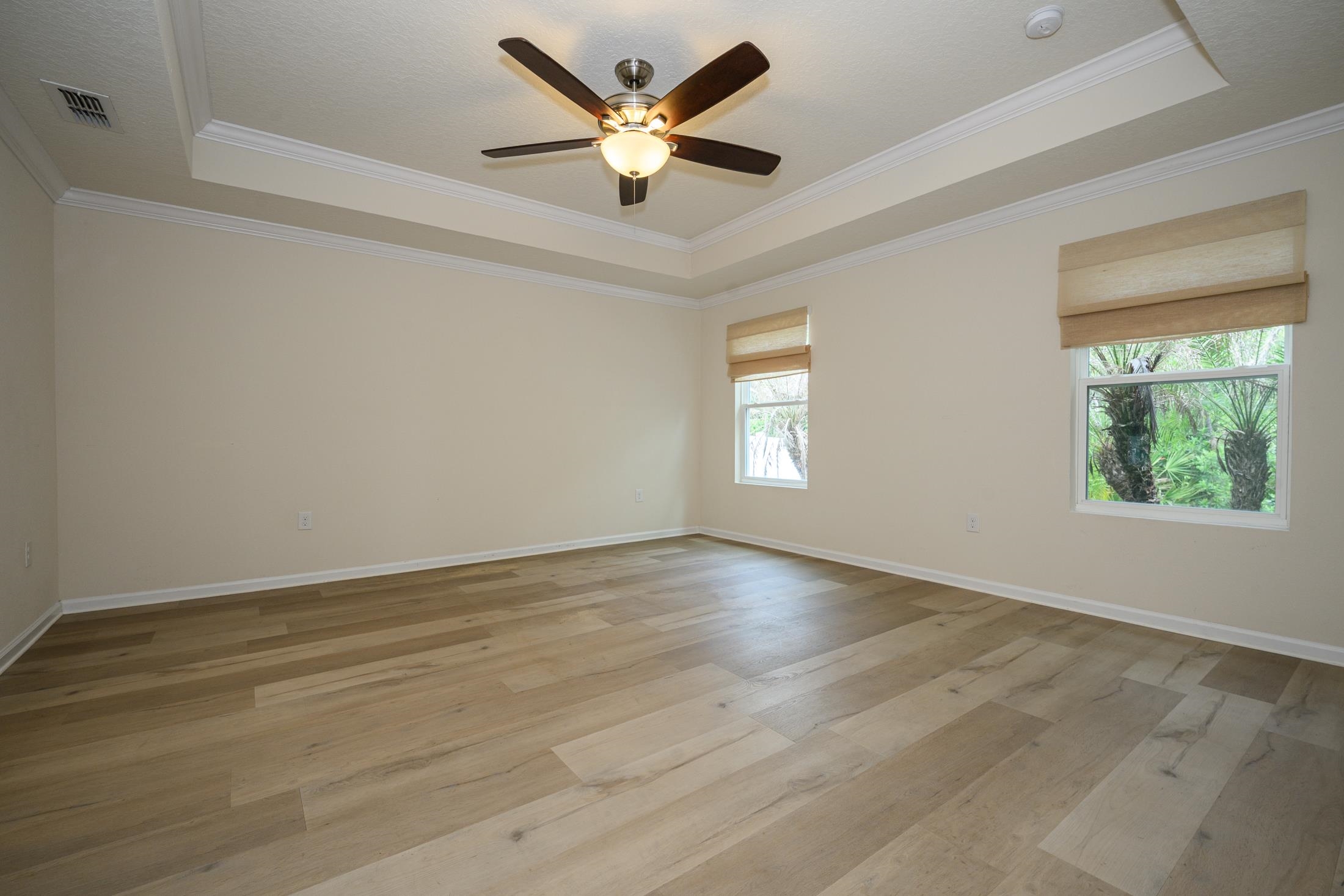 772 Pullman Circle St. Augustine, FL 32084 - Photo 46 of 77 an empty room with wooden floor and windows