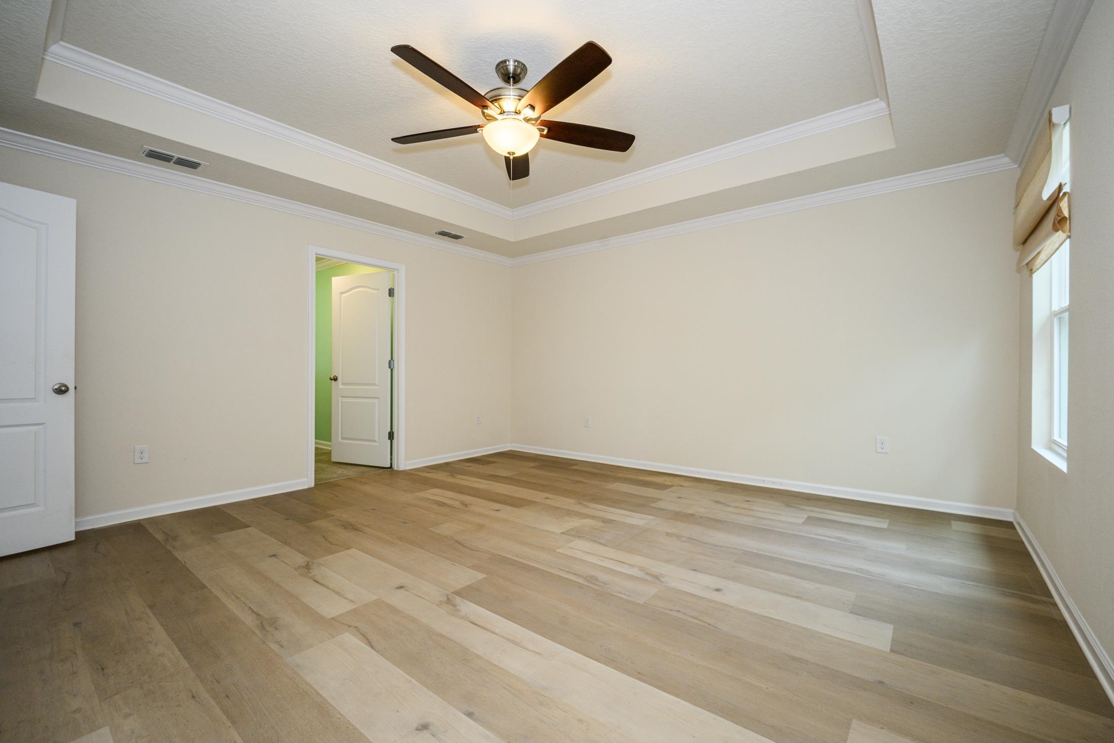 772 Pullman Circle St. Augustine, FL 32084 - Photo 47 of 77 an empty room with a window and a ceiling fan