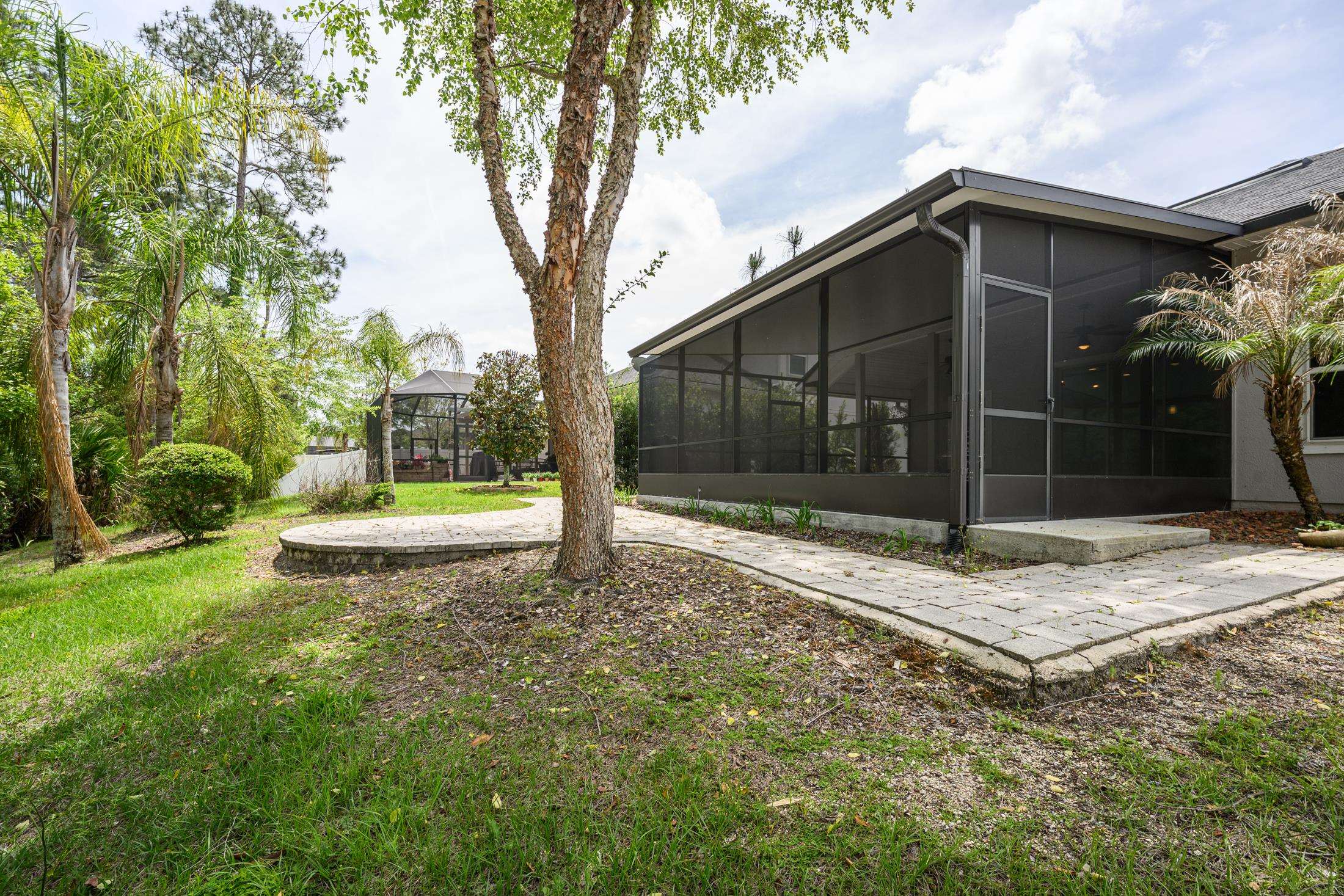 772 Pullman Circle St. Augustine, FL 32084 - Photo 60 of 77 a view of a house with backyard and tree