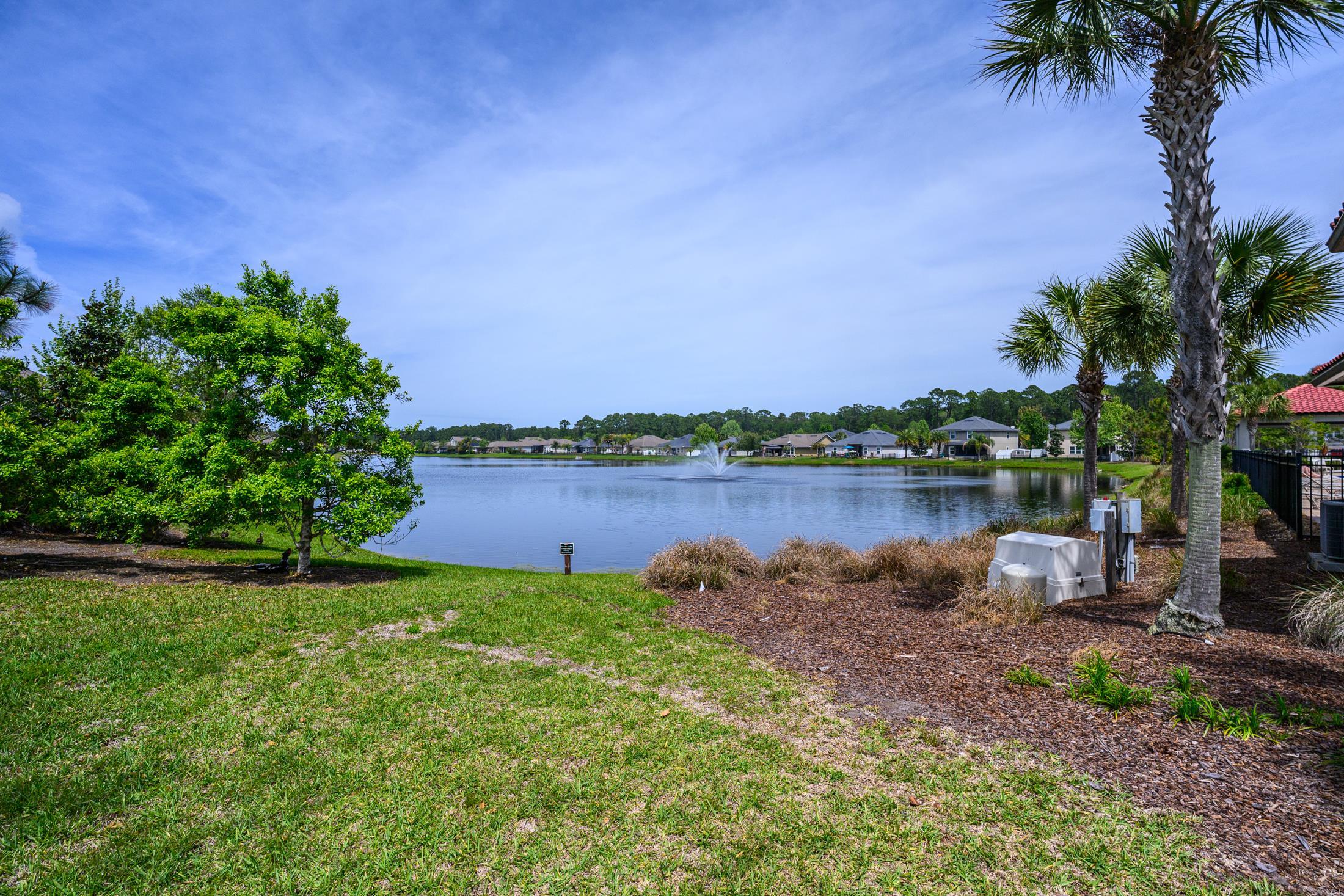 772 Pullman Circle St. Augustine, FL 32084 - Photo 68 of 77 a view of a lake with a house in the background