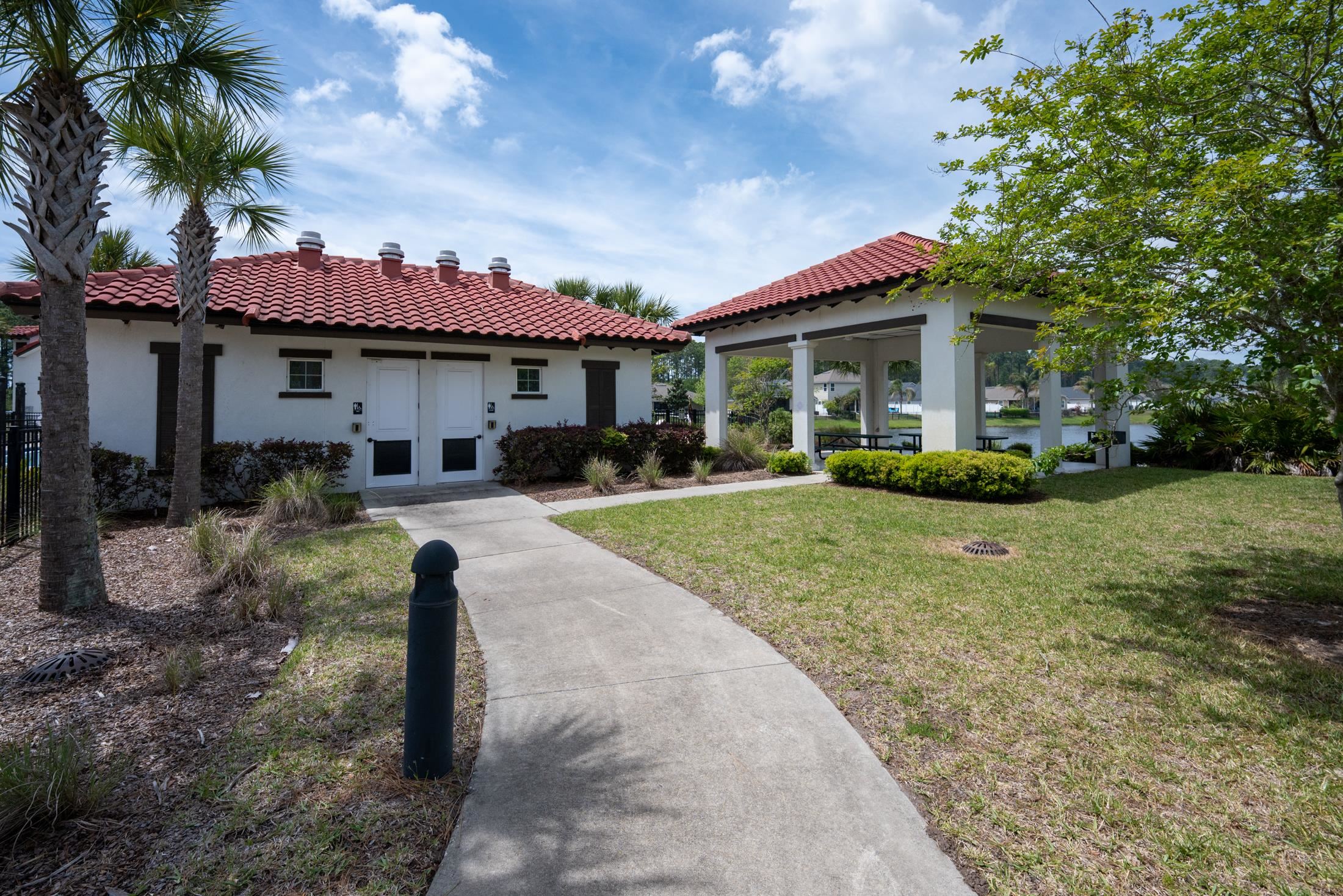 772 Pullman Circle St. Augustine, FL 32084 - Photo 74 of 77 a front view of a house with garden