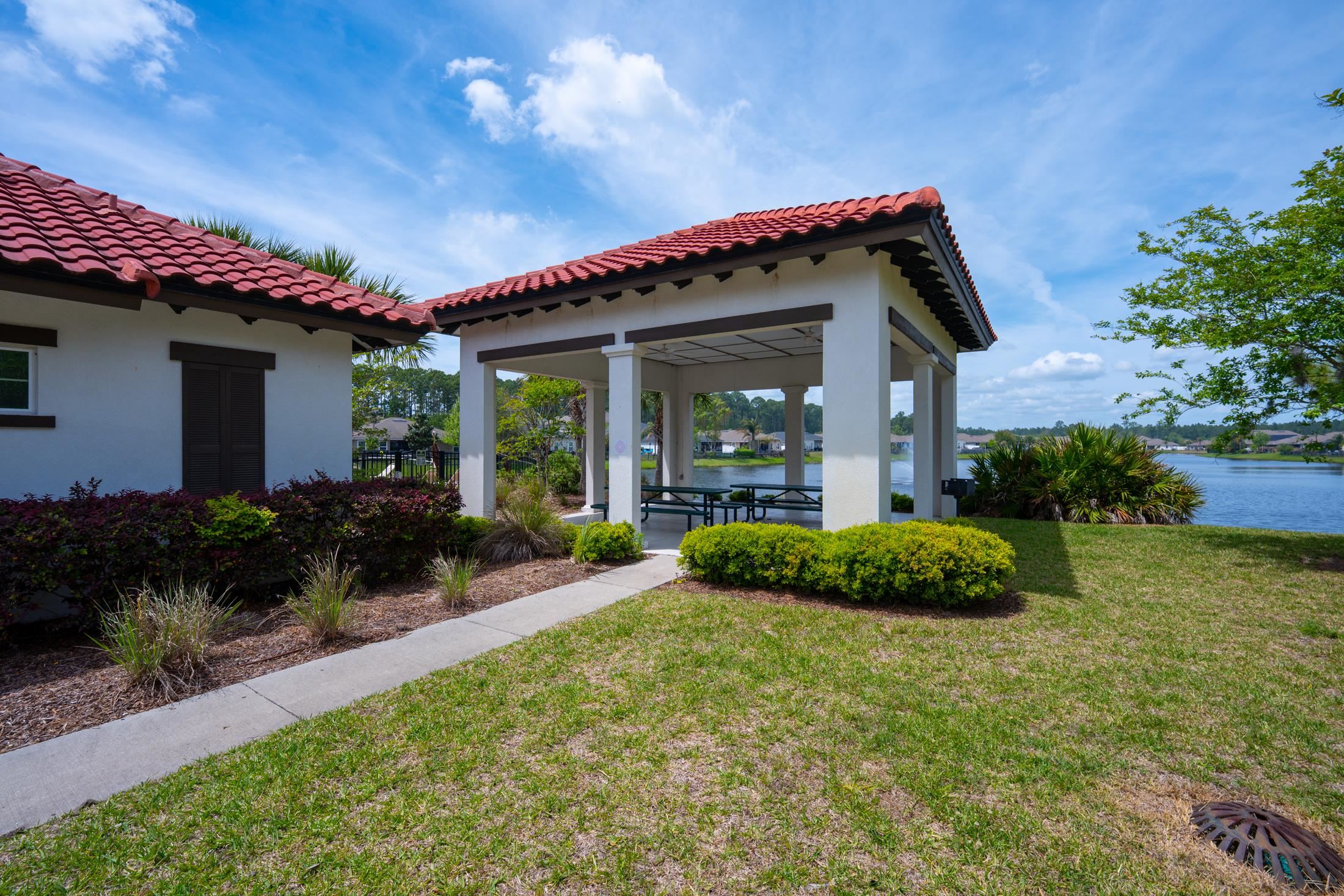 772 Pullman Circle St. Augustine, FL 32084 - Photo 75 of 77 a front view of a house with garden