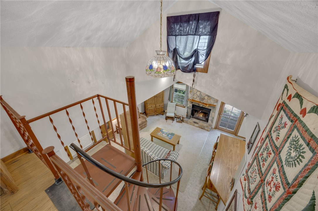 437 West Gate Road Pickens, SC 29671 - Photo 47 of 47 This inviting living area features a grand fireplace and an intriguing spiral staircase.