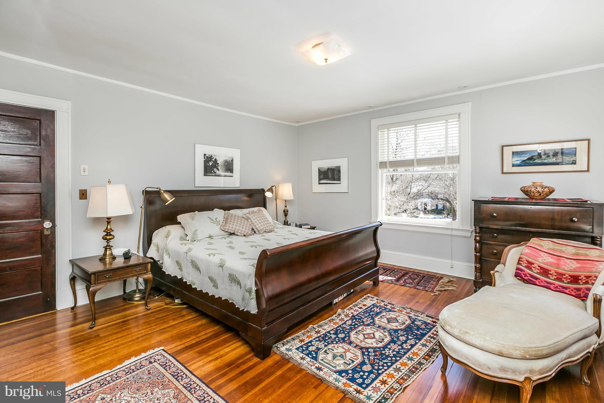 4904 Roland Avenue Baltimore, MD 21210 - Photo 22 of 27 a bedroom with a bed and a couch