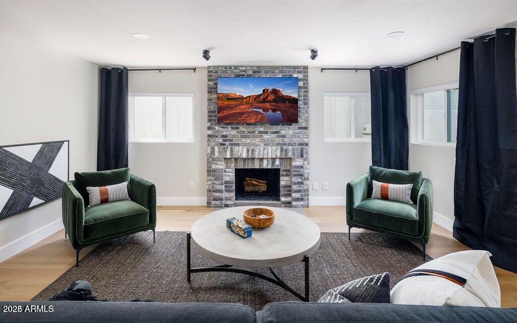 6174 East Janice Way Scottsdale, AZ 85254 - Photo 13 of 39 a living room with furniture and a fireplace