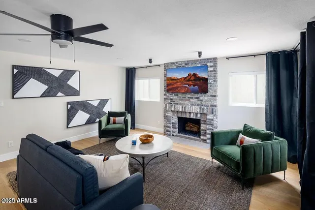 a living room with furniture and a fireplace