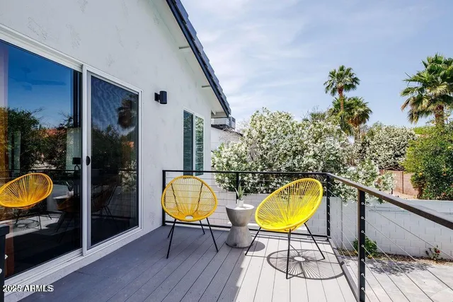 a view of a swimming pool with a lounge chairs