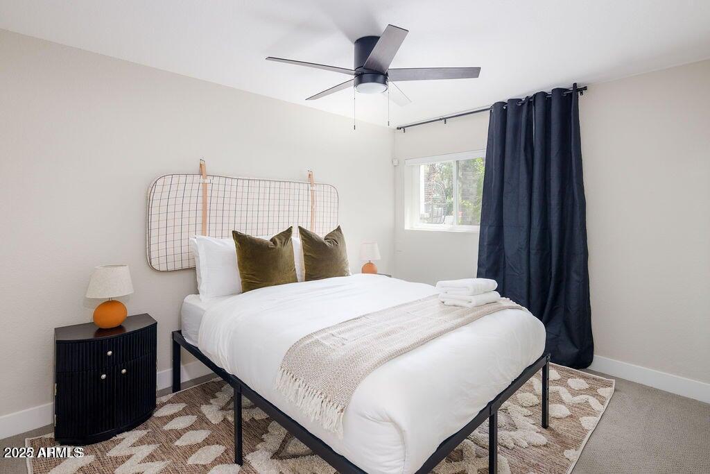 6174 East Janice Way Scottsdale, AZ 85254 - Photo 25 of 39 a bedroom with a bed and a table