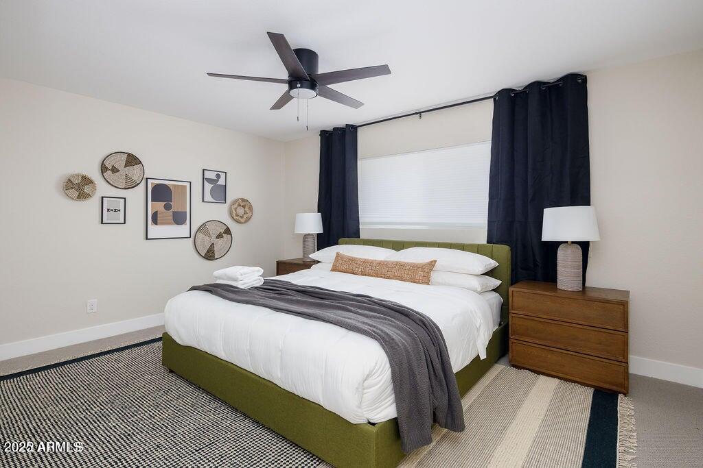 6174 East Janice Way Scottsdale, AZ 85254 - Photo 26 of 39 a bedroom with a bed and a lamp on dresser