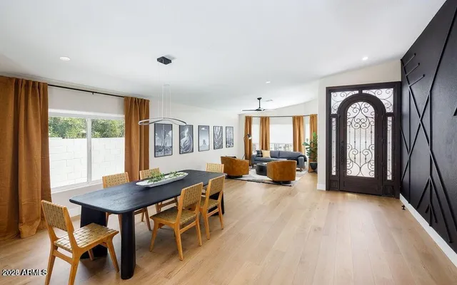 a view of a livingroom with furniture window and wooden floor