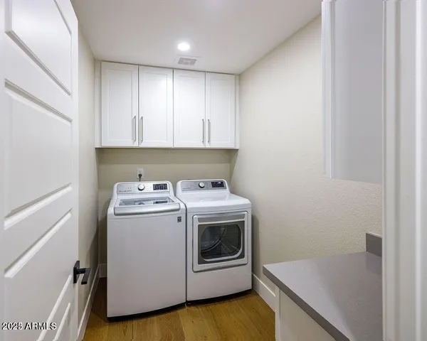 a view of a storage & utility room with washer and dryer