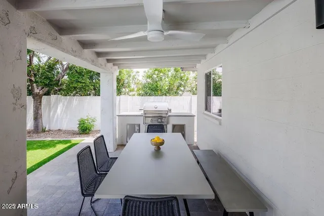 a view of a dining room with furniture window and outside view
