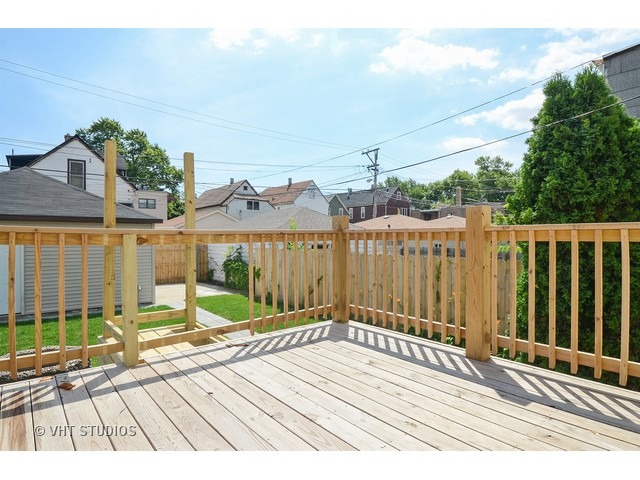 3323 North Troy Street Chicago, IL 60618 - Photo 20 of 25 a view of a house with a balcony