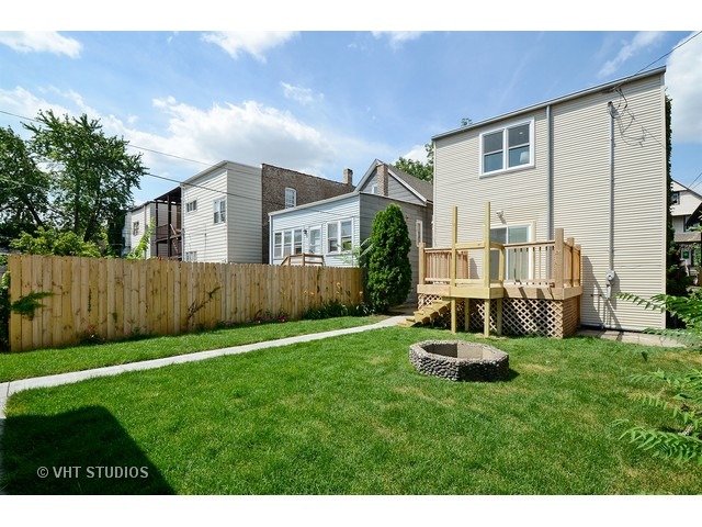 3323 North Troy Street Chicago, IL 60618 - Photo 21 of 25 a view of a house with a yard and sitting area