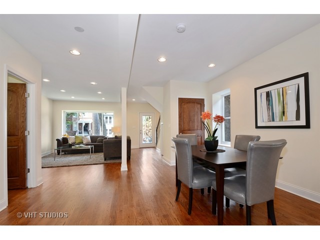 3323 North Troy Street Chicago, IL 60618 - Photo 4 of 25 a view of a dining room with furniture and wooden floor