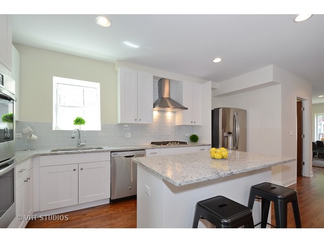 3323 North Troy Street Chicago, IL 60618 - Photo 6 of 25 a kitchen with a sink a counter space and appliances