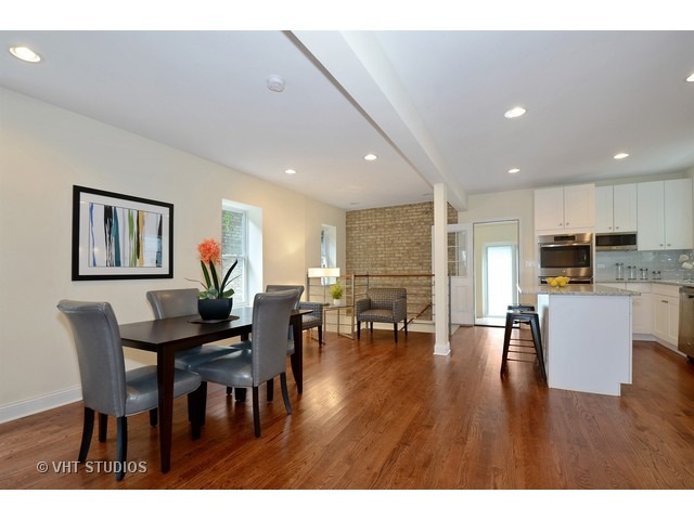 3323 North Troy Street Chicago, IL 60618 - Photo 7 of 25 a view of a dining room with furniture and wooden floor