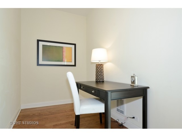 3323 North Troy Street Chicago, IL 60618 - Photo 8 of 25 a view of a dining room with furniture and a lamp
