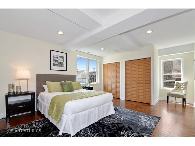 3323 North Troy Street Chicago, IL 60618 - Photo 9 of 25 a bedroom with a bed and a large window