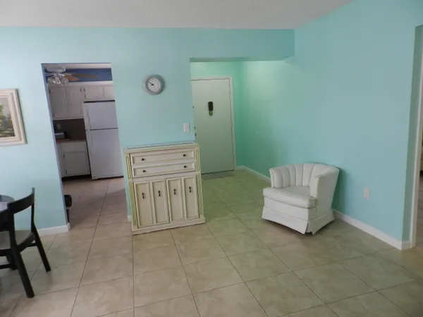 a hallway with a couch and a stove top oven