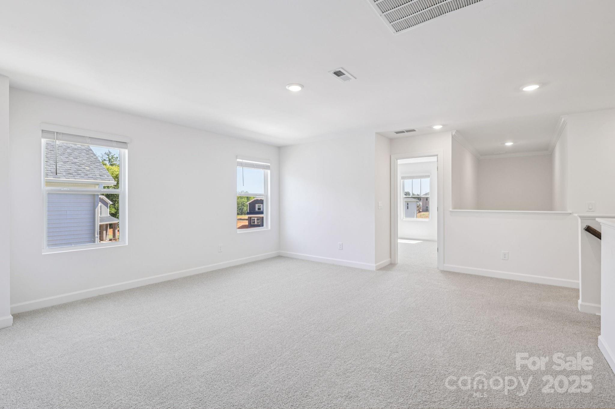 161 Murphy Mdw Road Mocksville, NC 27028 - Photo 11 of 29 an empty room with windows and entrance
